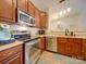 Stainless steel appliances and wood cabinets at 11719 Ridgeway Park Dr, Charlotte, NC 28277