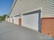 Row of attached garages offering convenient parking at 11719 Ridgeway Park Dr, Charlotte, NC 28277