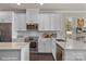 Modern kitchen with white cabinets and quartz countertops at 3004 Loso Ter # 56, Charlotte, NC 28217