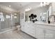 Elegant bathroom with double vanity, shower, and tiled floors at 2046 Alexander Village Main Dr, Charlotte, NC 28262