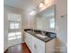 Bathroom with double vanity and granite countertop at 131 Renville Pl, Mooresville, NC 28115