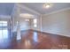 Spacious dining room with hardwood floors and views into adjacent rooms at 131 Renville Pl, Mooresville, NC 28115
