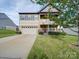 Two-story home with a two-car garage and landscaped yard at 131 Renville Pl, Mooresville, NC 28115