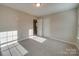 Simple bedroom with carpet flooring and a closet at 131 Renville Pl, Mooresville, NC 28115