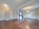 Open dining room with hardwood floors, and views to kitchen and living room at 131 Renville Pl, Mooresville, NC 28115