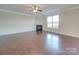 Spacious living area with hardwood floors, corner fireplace, and large windows at 131 Renville Pl, Mooresville, NC 28115