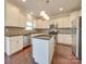 Modern kitchen with granite countertops and stainless steel appliances at 131 Renville Pl, Mooresville, NC 28115