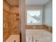 Relaxing bathroom with soaking tub and shower at 131 Renville Pl, Mooresville, NC 28115