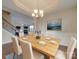 Elegant dining room with chandelier and hardwood floors at 131 Renville Pl, Mooresville, NC 28115