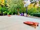 Spacious backyard with cornhole, seating area, and basketball court at 1011 Ratchford Rd, York, SC 29745