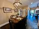 Bright dining area with a wood table, four chairs, and access to kitchen and backyard at 1011 Ratchford Rd, York, SC 29745