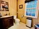 Small bathroom with toilet, sink, and mirror at 1011 Ratchford Rd, York, SC 29745