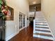 Bright entryway with hardwood floors, staircase, and French doors at 1011 Ratchford Rd, York, SC 29745