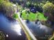 Aerial view of house on waterfront property with lush green landscape at 1011 Ratchford Rd, York, SC 29745