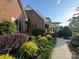 Landscaped side yard with brick walkway leading to home's entrance at 1011 Ratchford Rd, York, SC 29745
