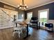 Bright home office features a large live-edge desk, built-in shelving, and French doors at 1011 Ratchford Rd, York, SC 29745