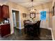 Charming dining area with a wooden table and chairs, near kitchen and exterior access at 1011 Ratchford Rd, York, SC 29745