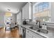 Modern kitchen with double sink, granite countertops and stainless steel appliances at 15862 Kiser Corner Ln, Davidson, NC 28036