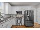 Modern kitchen with stainless steel appliances and granite countertops at 15862 Kiser Corner Ln, Davidson, NC 28036