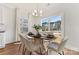 Bright dining area with a contemporary table, chairs and access to the deck at 432 Kingsway Cir, Charlotte, NC 28214