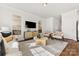 Light and airy living room with contemporary furniture and large windows at 432 Kingsway Cir, Charlotte, NC 28214