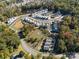 Aerial view of community with pond and homes at 504 Kingsway Cir, Charlotte, NC 28214
