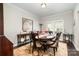 Bright dining room featuring hardwood floors and an elegant table setting at 131 Aztec Cir, Mooresville, NC 28117