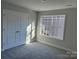 Bright bedroom with double doors and carpet at 112 Imperial Way # 2A, Albemarle, NC 28001