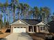 Brick home with gray accents, two-car garage, and a landscaped yard at 112 Imperial Way # 2A, Albemarle, NC 28001