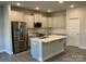 Modern kitchen with white cabinets, stainless steel appliances, and an island at 112 Imperial Way # 2A, Albemarle, NC 28001