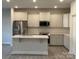 Modern kitchen with stainless steel appliances and an island at 112 Imperial Way # 2A, Albemarle, NC 28001