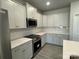 Modern kitchen with white cabinets and stainless steel appliances at 112 Imperial Way # 2A, Albemarle, NC 28001