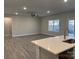 Spacious living room with hardwood floors and large windows at 112 Imperial Way # 2A, Albemarle, NC 28001
