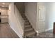 Staircase with grey carpet runner and white railing at 112 Imperial Way # 2A, Albemarle, NC 28001
