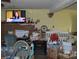 A cluttered living room with a TV and fireplace at 138 Hatley Farm Ln, Stony Point, NC 28678