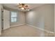 Bright bedroom with ceiling fan and window at 151 Cedar Hollow St, Fort Mill, SC 29715