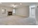 Living room with a fireplace, carpet, and neutral tones at 151 Cedar Hollow St, Fort Mill, SC 29715