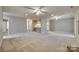 Open living area with kitchen access and neutral decor at 151 Cedar Hollow St, Fort Mill, SC 29715