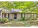 Tan colored house with mature landscaping and walkway at 151 Cedar Hollow St, Fort Mill, SC 29715