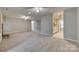 Open living room with fireplace and view into the kitchen at 151 Cedar Hollow St, Fort Mill, SC 29715