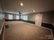 Open living room with neutral walls and hardwood floors at 131 Glendale Se Ave, Concord, NC 28025