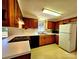 View of kitchen with white appliances and oak cabinets at 1135 Pinehaven Dr, New London, NC 28127