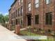 Brick townhome exterior with fenced courtyard and optional gate at 220 Gilead Rd, Huntersville, NC 28078