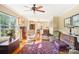 Living room with hardwood floors, comfy chairs, and a ceiling fan at 1026 Holly Dr, Gastonia, NC 28054
