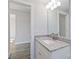 Simple bathroom with single vanity, granite countertop, and a mirror at 1026 Heath Helms Rd, Monroe, NC 28110