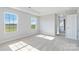 Spacious bedroom with carpet flooring and large windows offering natural light at 1026 Heath Helms Rd, Monroe, NC 28110