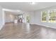 Open kitchen with island, stainless steel appliances, and hardwood floors at 1026 Heath Helms Rd, Monroe, NC 28110