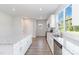 Modern kitchen with white cabinets, granite countertops, and stainless steel appliances at 1026 Heath Helms Rd, Monroe, NC 28110