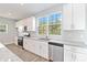 Bright kitchen featuring white cabinets, granite countertops, and stainless steel appliances at 1026 Heath Helms Rd, Monroe, NC 28110