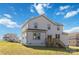 Rear view of two-story house with gray siding and deck, showcasing a rural setting at 1026 Heath Helms Rd, Monroe, NC 28110